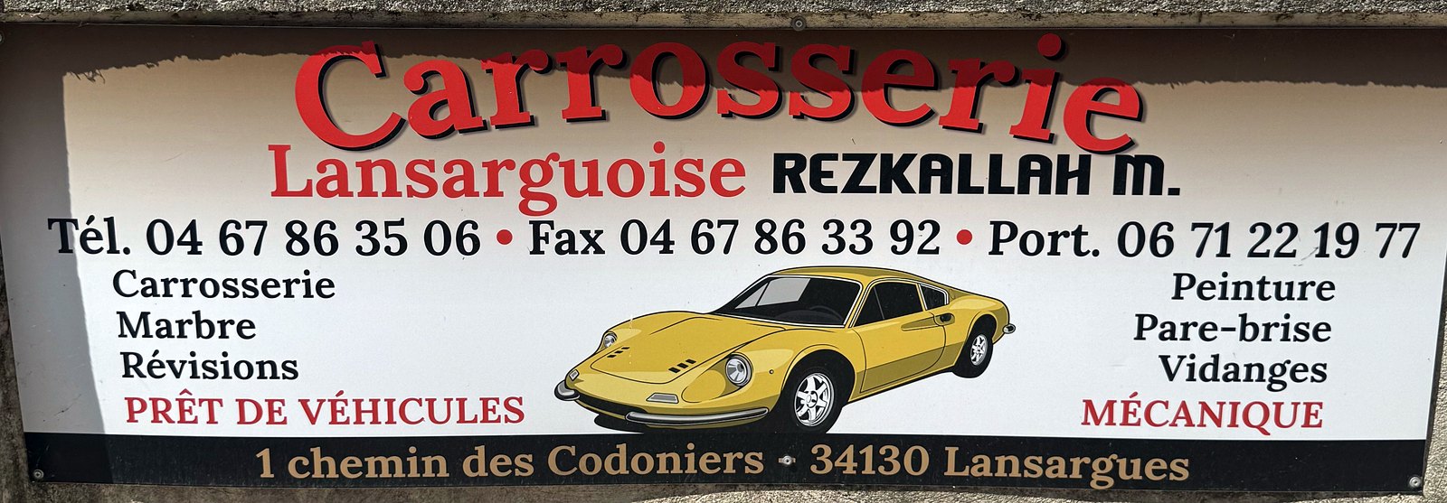 L'enseigne historique de la Carrosserie Lansarguoise